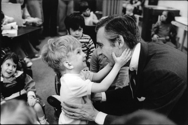 Fred Rogers meets children at a school in Pittsburgh in a photograph taken by Jim Judkis