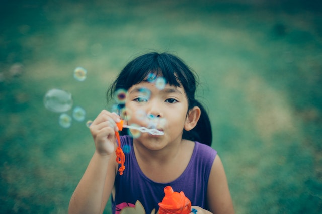 2023 Annual Child Welfare Law Update Conference - Girl child blows bubbles